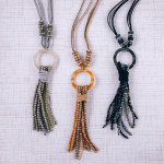 Wholesale faux leather necklace faceted beaded tassel detail resin accent Pendan