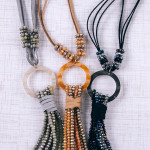 Wholesale faux leather necklace faceted beaded tassel detail resin accent Pendan
