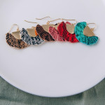 Wholesale feather inspired tassel earrings snakeskin print gold metal accent